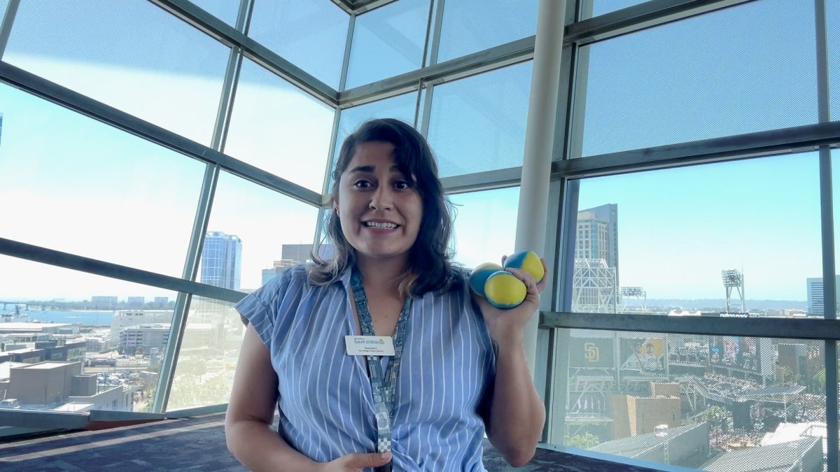 Staff member holding juggling equipment