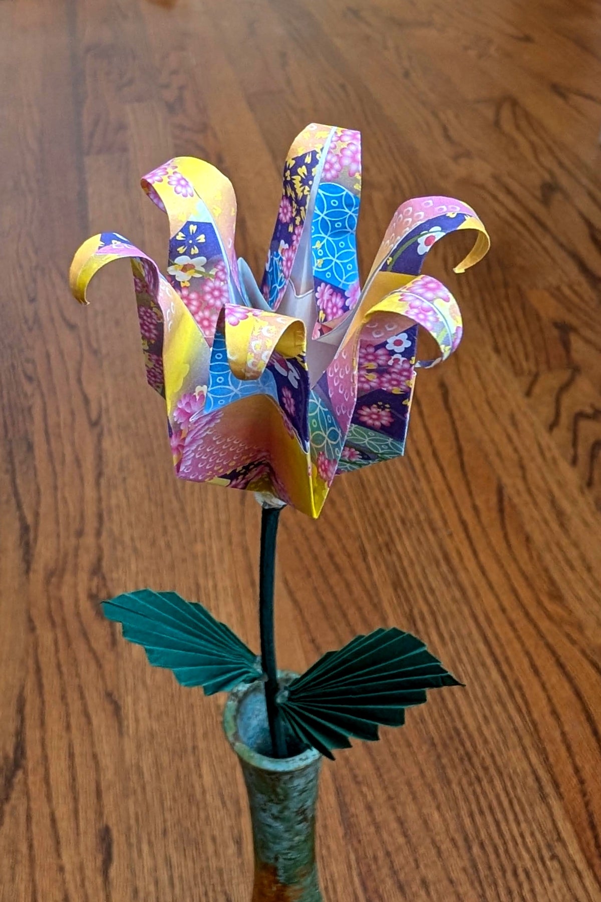 Paper folded into an iris using origami techniques.