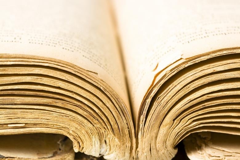 Close-up of the bottom edge of an opened book.