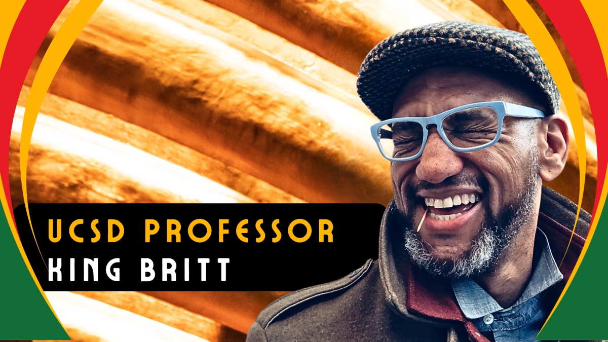A man in a beret and blue glasses smiles widely with his eyes closed with a golden background. Text: UCSD Professor King Britt