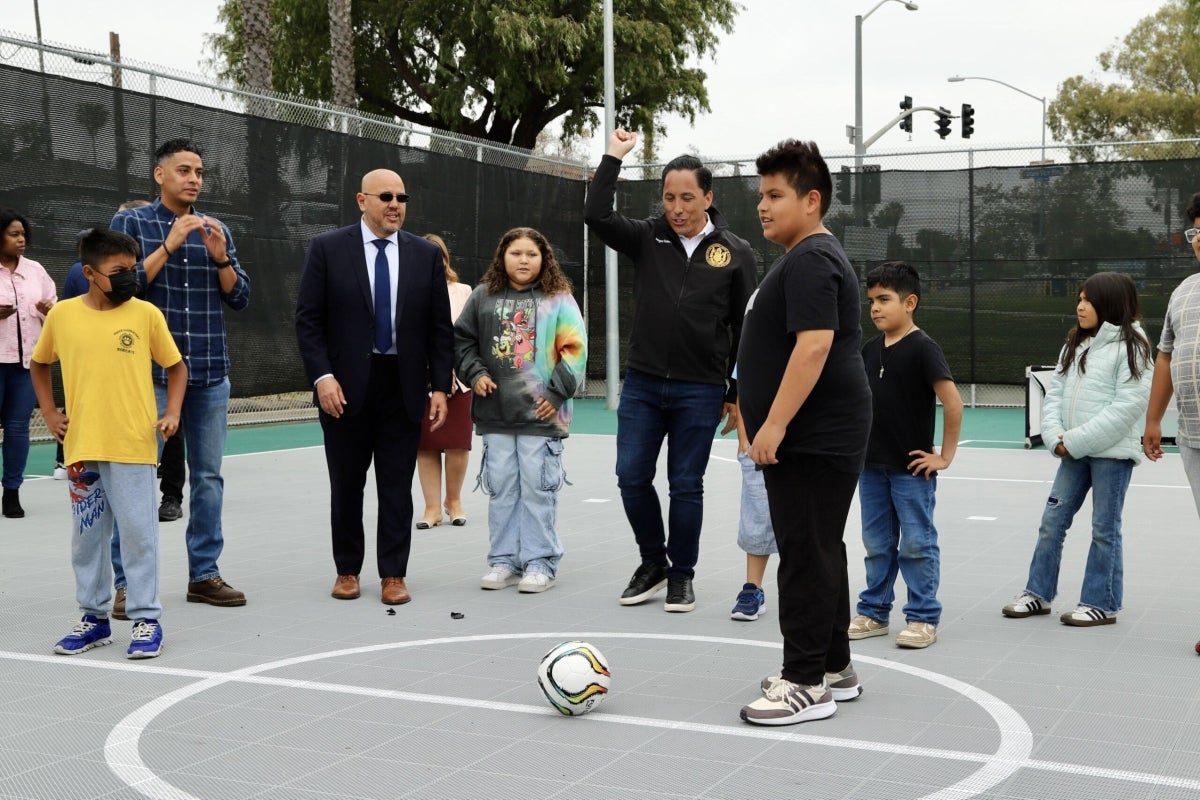 Mayor Todd Gloria at a basketball court