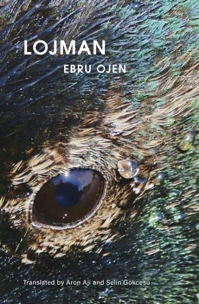 The cover features a close-up of a bird's eye surrounded by blue and green feathers, with the title, author's name, and translator's name in white text.