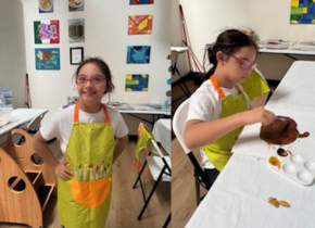 Photos of a young girl wearing a bright yellow apron painting in an art studio