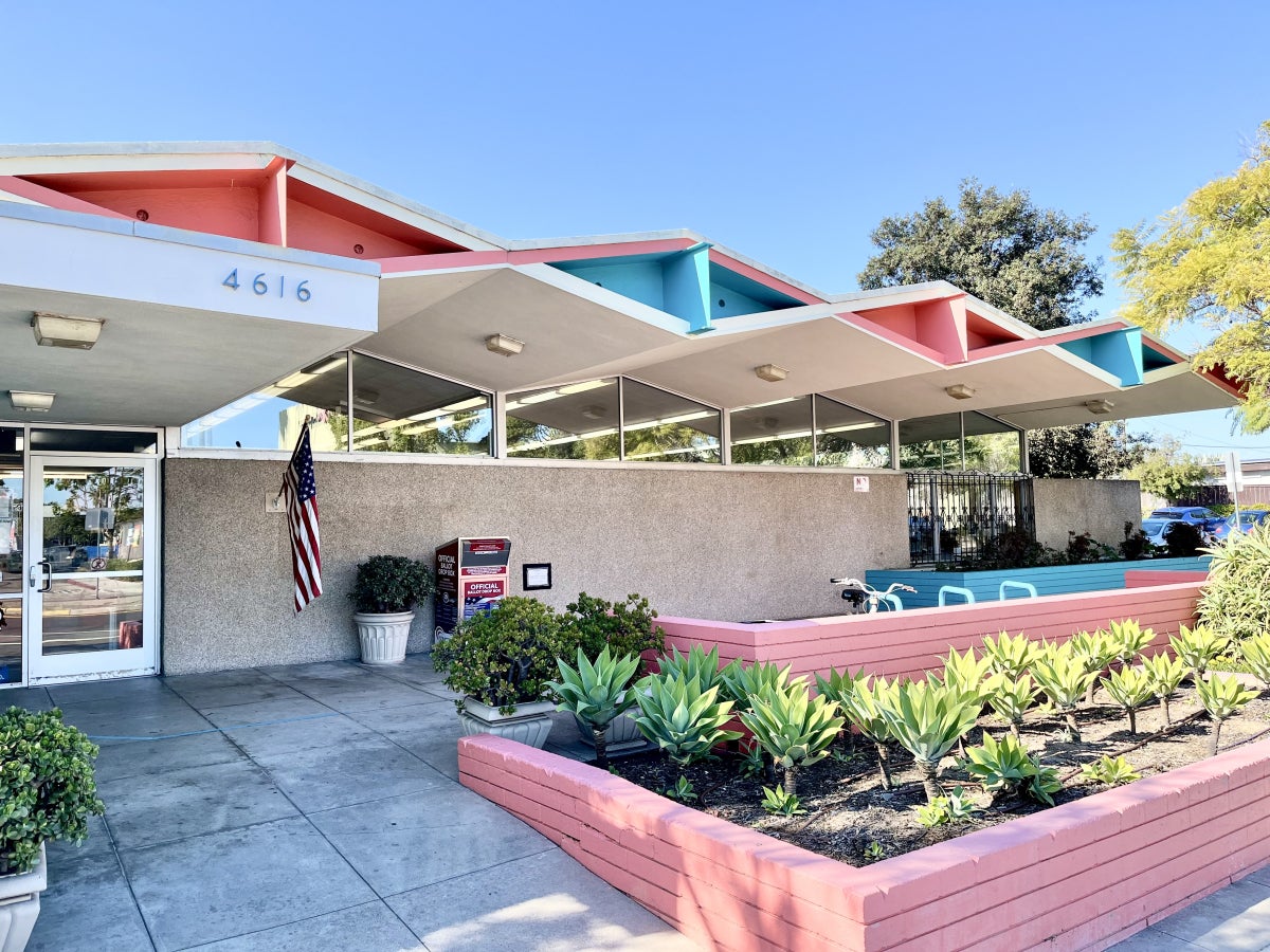 Front Entrance on Clairemont Drive: street view of the North Clairemont Library on Clairemont Drive, with a close up of the midcentury modern Googie architecture styled roof featuring bold triangular shapes. 