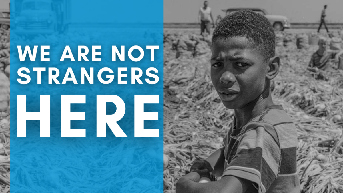 Black and white portrait of a young Black child in the fields with farm workers in the background. Title: We Are Not Strangers Here 