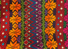 Close up photo of a colorful geometric fabric pattern