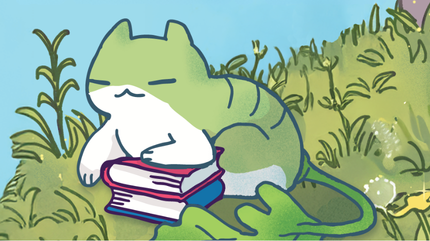 Green cat sleeping outside on the grass resting on two stacked books