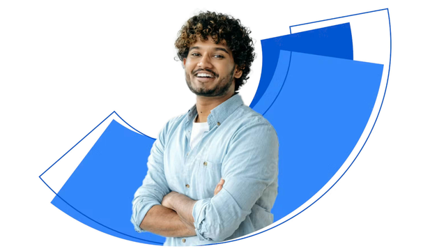 Bearded Young Man with curly hair crosses his arms and smiles in front of stylized blue quarter circle shapes.