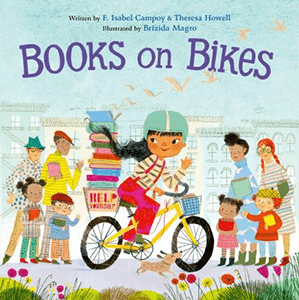 Illustrated bool cover of a girl riding a bike on a city sidewalk with  . Her back basket is filled with books. There are citizens of multiple ages and cultures on the sidewalk holding books.