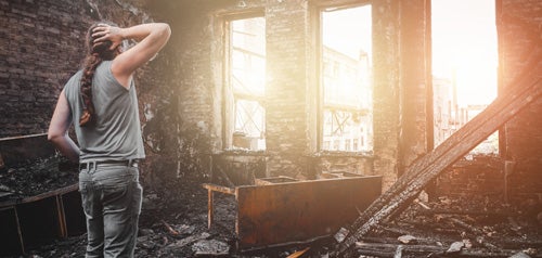 man in burned out building