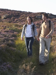Man and woman walking on a trail