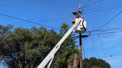 City electrician fixing a streetlight