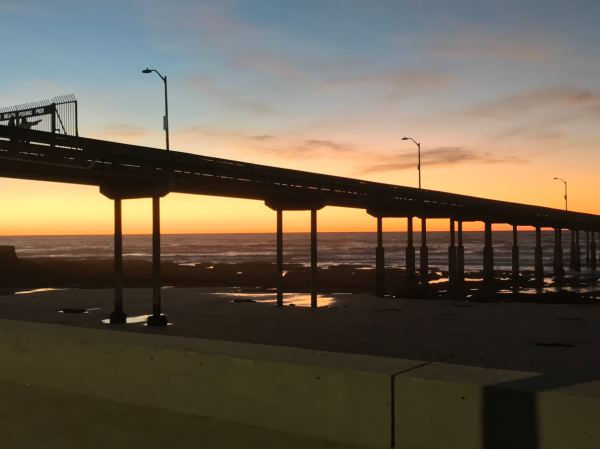 Sunset behind Ocean Beach Pier.