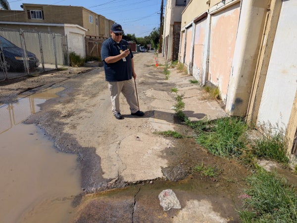 Code enforcement employee in an alley