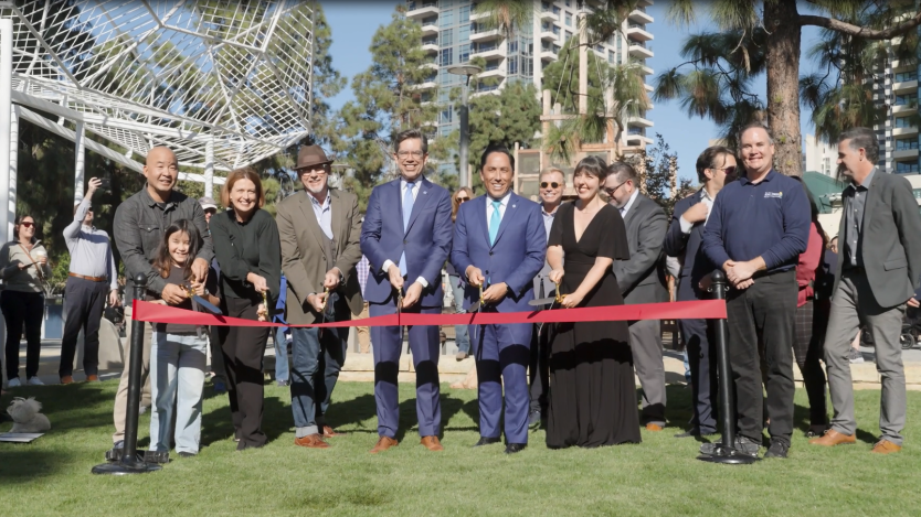 Mayor, Councilmember, community leaders, and City staff cutting ribbon. 