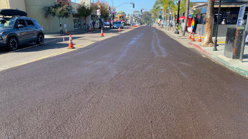 right side of the street with a fresh slurry seal treatment
