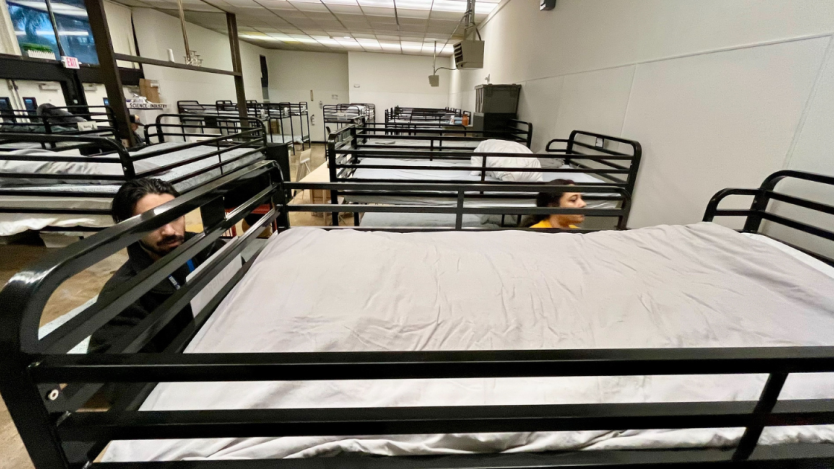 Staff setting up beds at Old Central Library