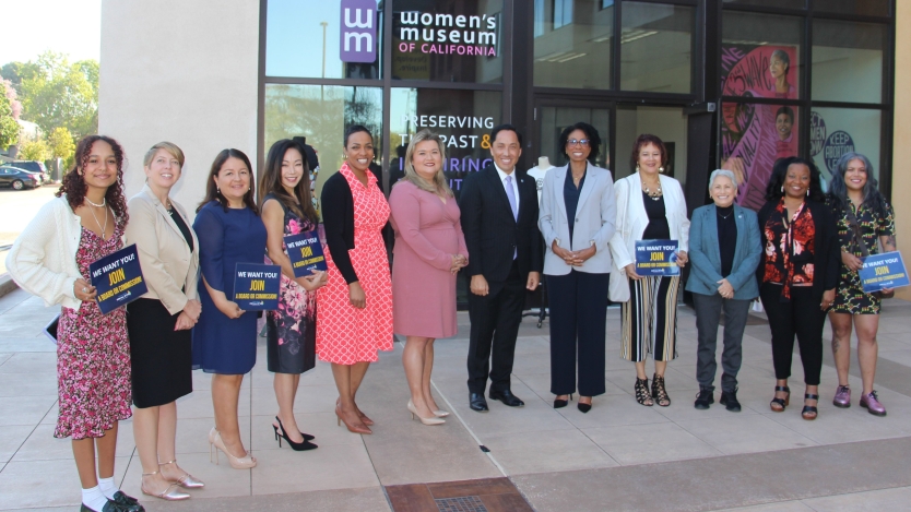 Mayor Todd Gloria and women in front of building 