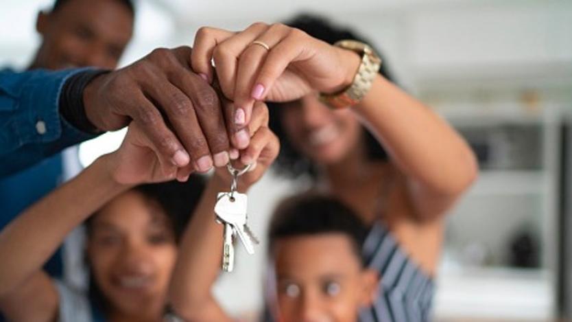 Family Holding Home Keys