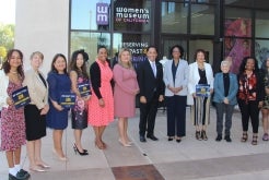 Mayor Todd Gloria and women in front of building 