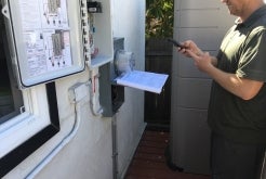 Customer taking a photo of plans at home