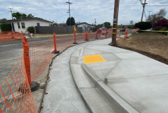 newly built sidewalk and curb ramp