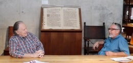 Two poets sitting in conversation