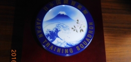 Brown wooden Japanese Training Squadron plaque