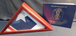 American Flag in Display Box with Book Titled "USS Omaha (LCS12)"