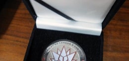 Silver Coin of Maple Leaf Large w/Black and Red Writing "Consulate at DU Canada 1867-2017 Canada a San Diego"