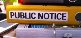 Photo of Yellow Office Folder with Inscription Public Notice on Office Desktop with Office Supplies and Modern Laptop