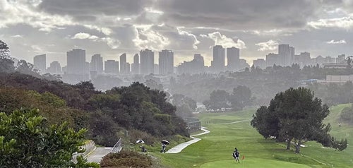 The Balboa Golf Course with downtown in the background on cloudy day