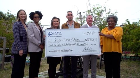 Councilmembers with large check 