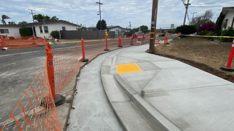 newly built sidewalk and curb ramp