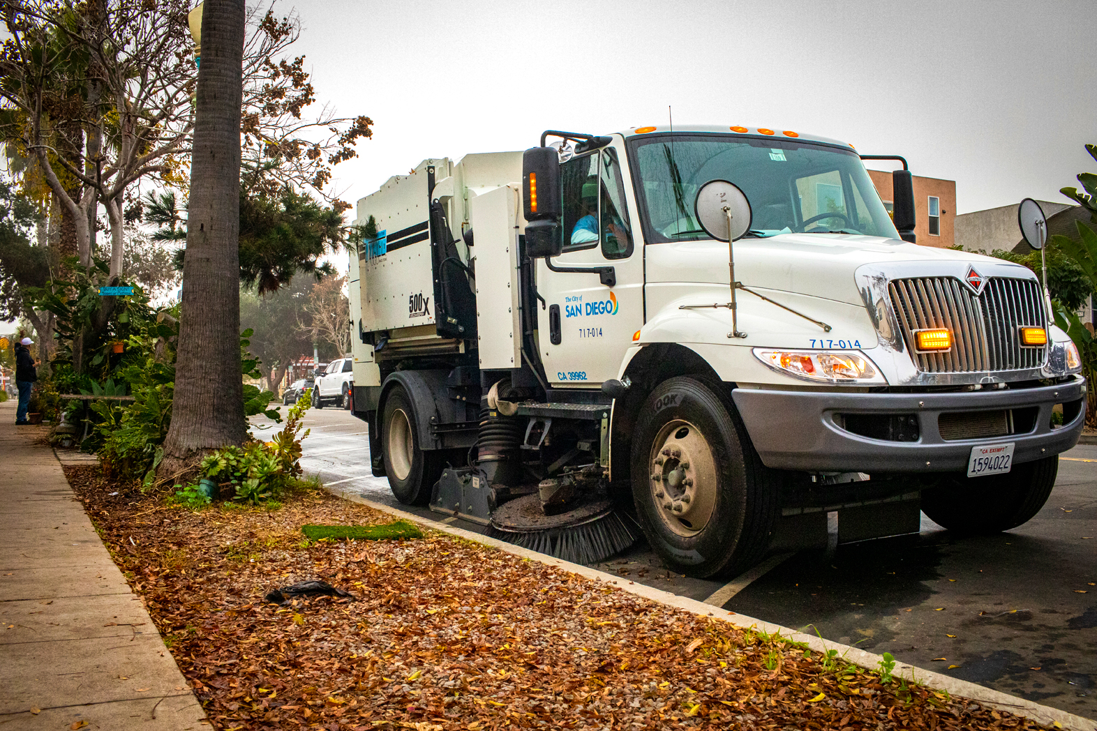 City of San Diego street sweeper cleaning up a road