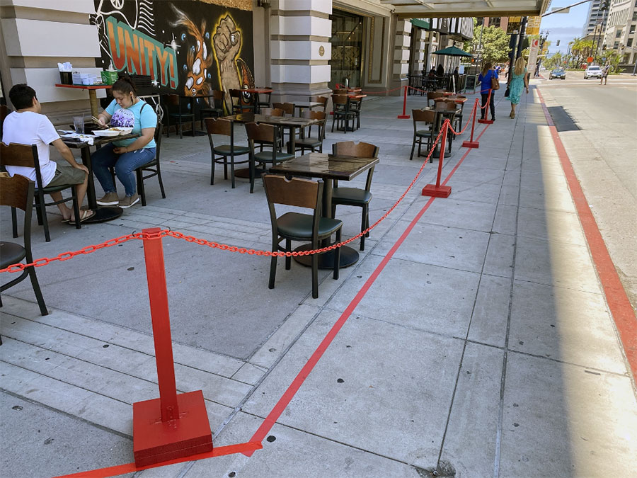 Dining tables placed on a sidewalk