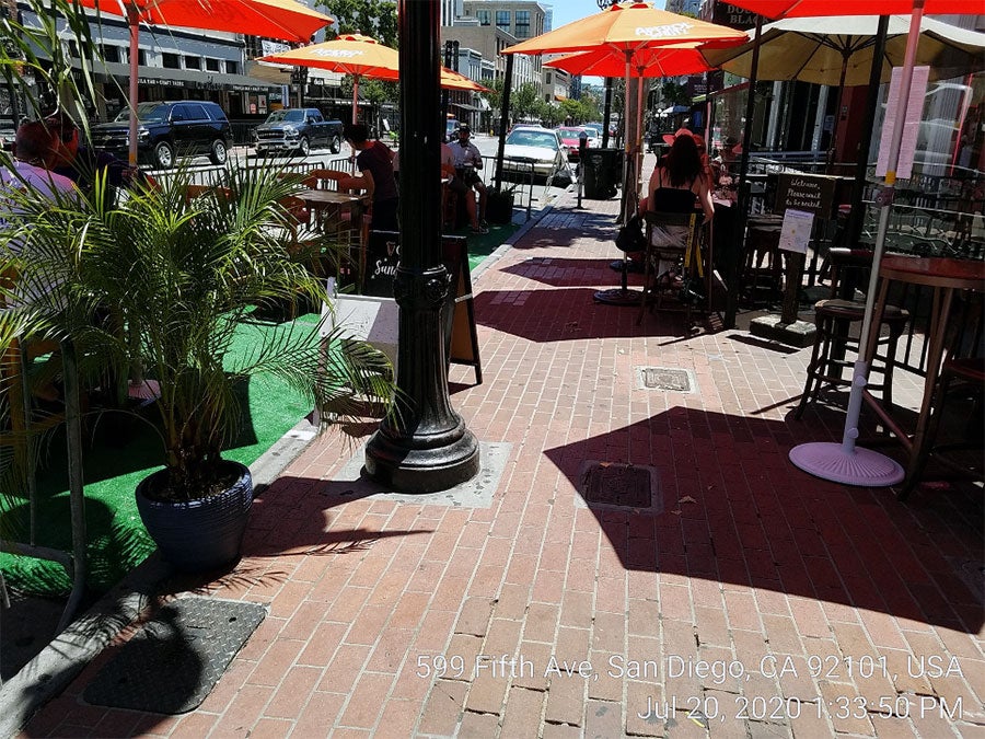 Dining tables placed on a sidewalk