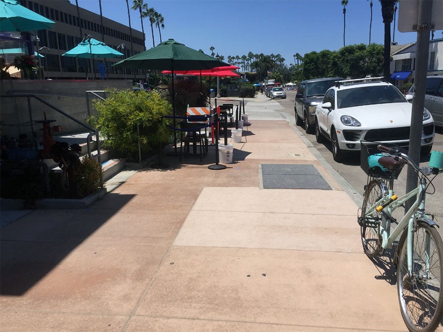 Dining tables placed on a sidewalk