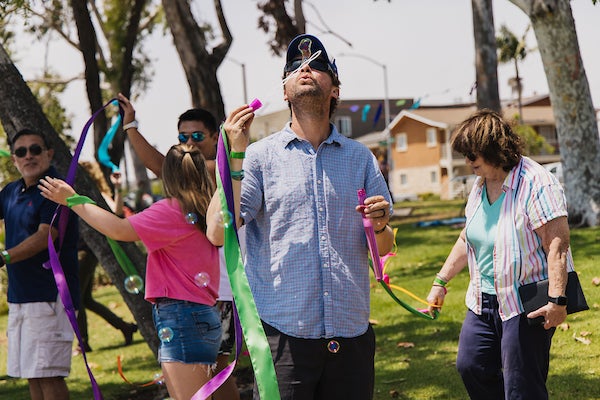 Art participants working with yarn