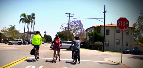 Bicyclists at a stop sign